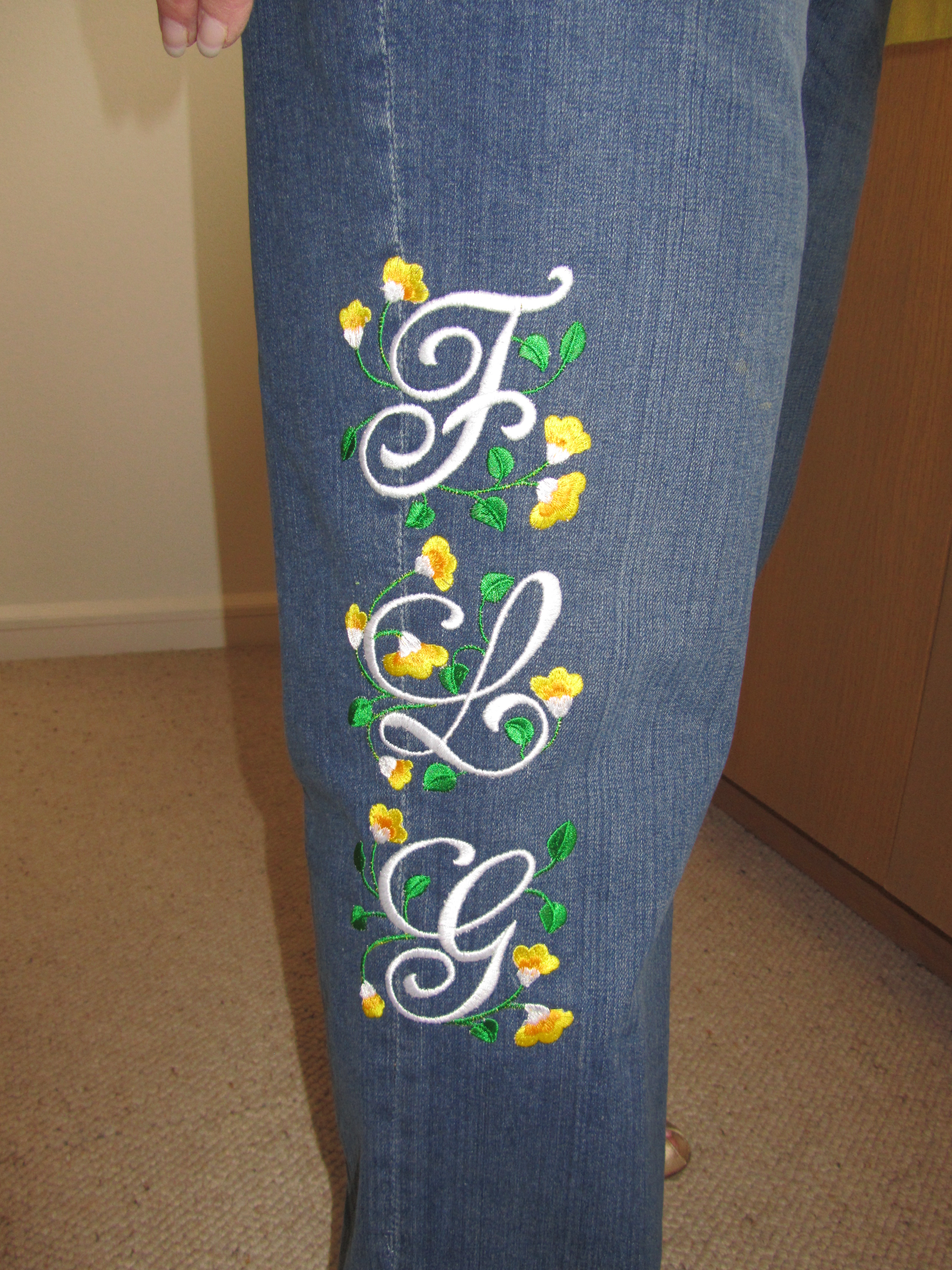 Custom embroidered jeans, jeans with stitched monograms, embroidered monograms